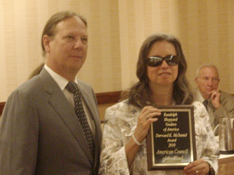 Melanie Brunson accepting the ACB award